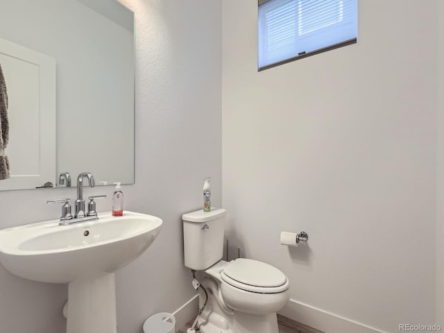 bathroom with toilet and sink