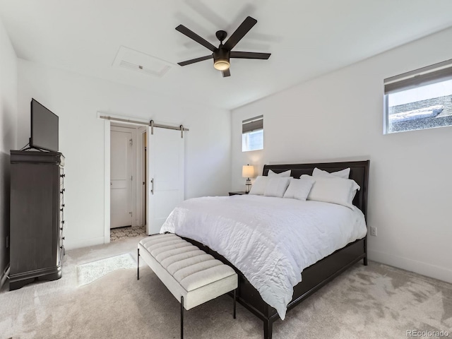 bedroom with multiple windows, ceiling fan, and light colored carpet