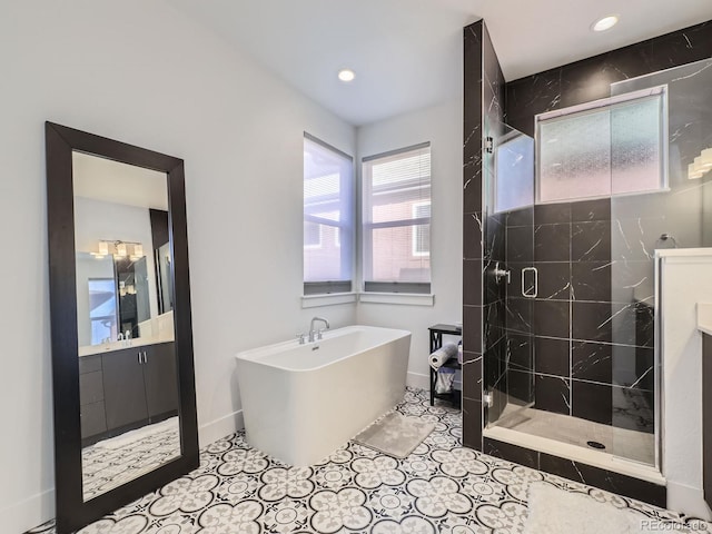 bathroom with tile patterned floors, vanity, and shower with separate bathtub