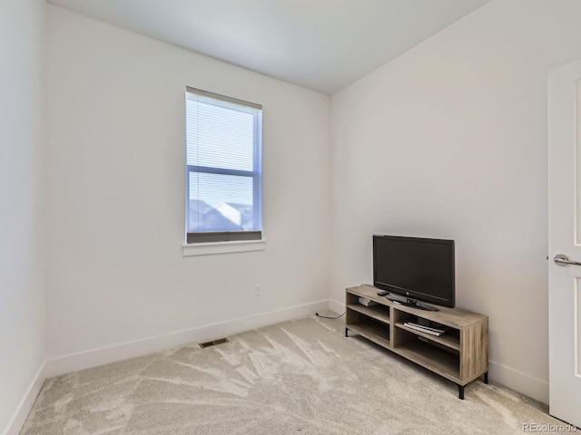 spare room with light colored carpet