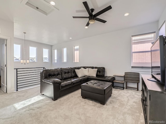 living room with light carpet and ceiling fan