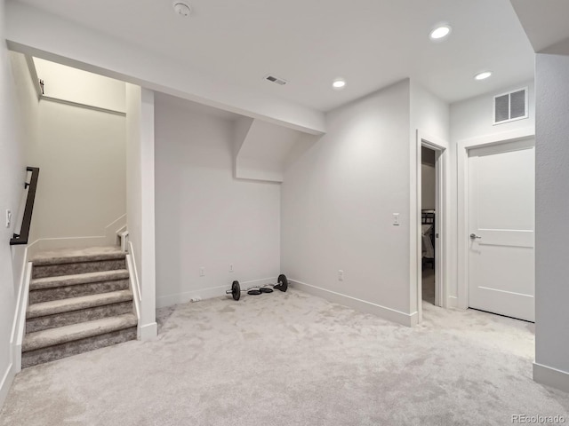 basement with light colored carpet