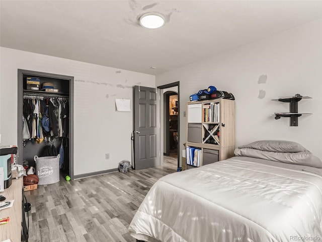 3081 W 18th Ave, Denver, CO 80204 - bedroom with wood finished floors and a closet