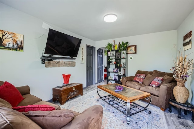 3081 W 18th Ave, Denver, CO 80204 - living room with arched walkways and light wood-style flooring