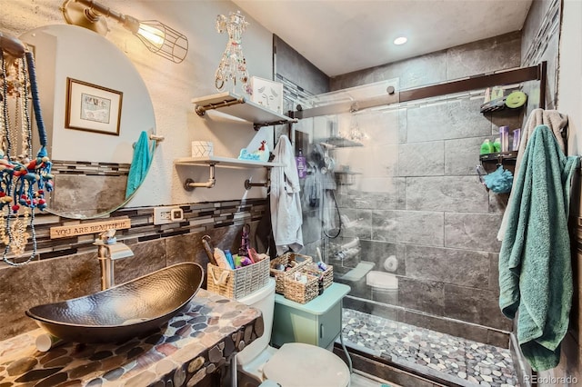 3081 W 18th Ave, Denver, CO 80204 - bathroom with tile walls, a walk in shower, and a wainscoted wall
