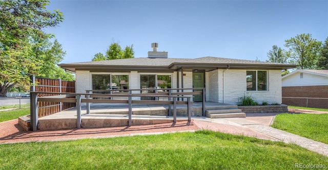 735 Valley Rd, Colorado Springs, CO 80904 - view of front of property featuring a chimney, stone siding, and roof with shingles