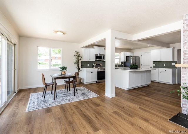 735 Valley Rd, Colorado Springs, CO 80904 - dining space with wood finished floors and baseboards