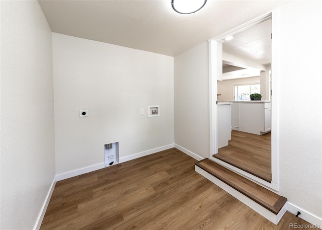 735 Valley Rd, Colorado Springs, CO 80904 - washroom featuring hookup for an electric dryer, washer hookup, wood finished floors, and baseboards
