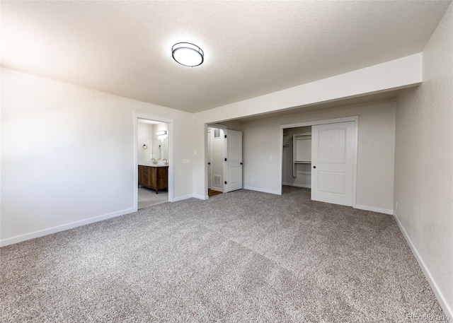 735 Valley Rd, Colorado Springs, CO 80904 - unfurnished bedroom featuring carpet, baseboards, a closet, and connected bathroom