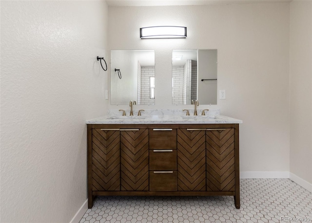 735 Valley Rd, Colorado Springs, CO 80904 - bathroom with double vanity and baseboards
