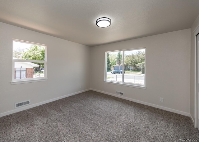 735 Valley Rd, Colorado Springs, CO 80904 - spare room featuring carpet and baseboards