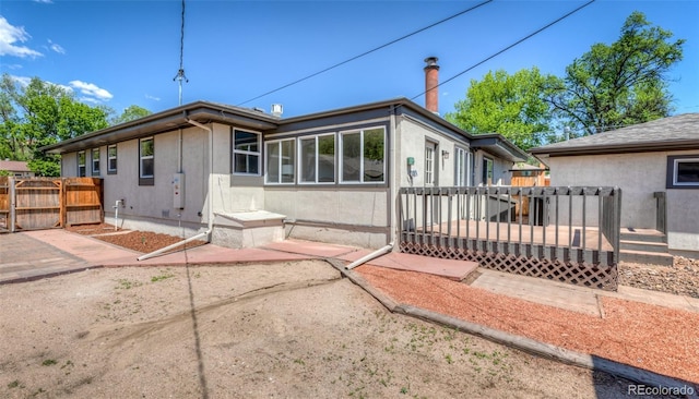 735 Valley Rd, Colorado Springs, CO 80904 - rear view of property with a deck and stucco siding
