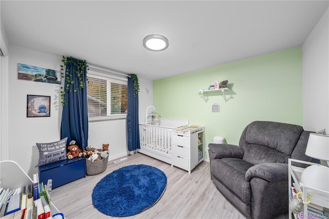 bedroom with light hardwood / wood-style floors