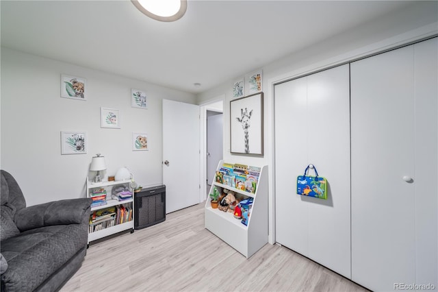 playroom featuring light wood-type flooring