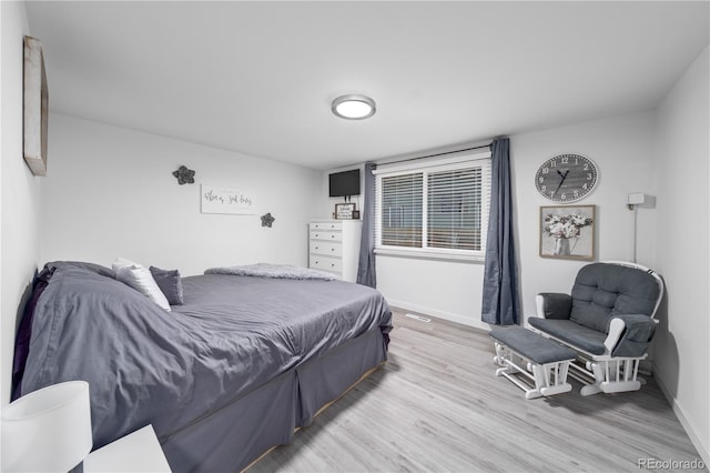 bedroom featuring light wood-type flooring