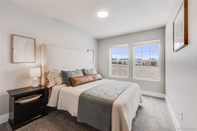 bedroom with carpet and baseboards