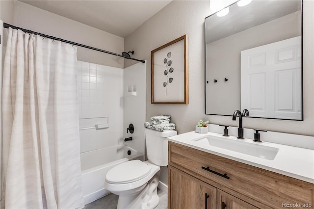 bathroom with shower / bath combo, vanity, and toilet