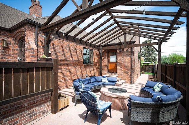view of patio / terrace featuring an outdoor living space with a fire pit, a pergola, and a fenced backyard