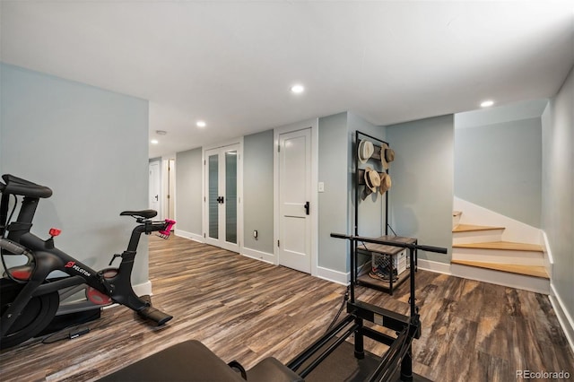 workout room with wood finished floors, baseboards, recessed lighting, and french doors