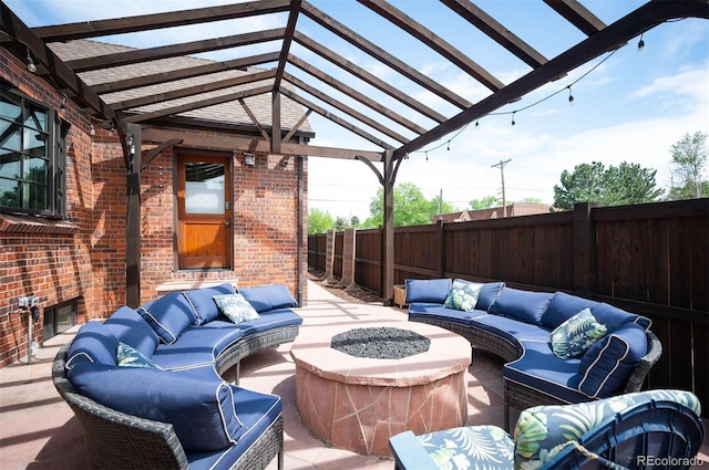 view of patio / terrace featuring an outdoor living space with a fire pit, a pergola, and fence