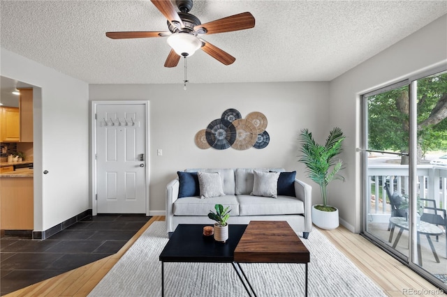 13404 E Jewell Ave Unit 101, Aurora, CO 80012 - living room with a textured ceiling and a ceiling fan