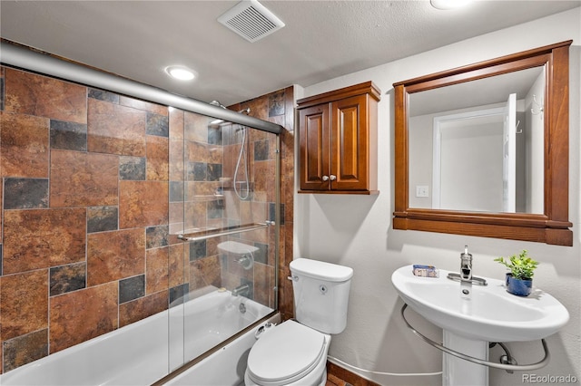 13404 E Jewell Ave Unit 101, Aurora, CO 80012 - full bathroom featuring bath / shower combo with glass door and baseboards