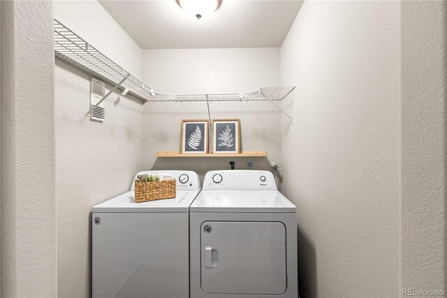 13404 E Jewell Ave Unit 101, Aurora, CO 80012 - laundry room with washing machine and dryer