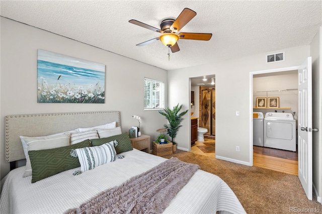 13404 E Jewell Ave Unit 101, Aurora, CO 80012 - bedroom featuring washer and dryer, light colored carpet, a textured ceiling, ensuite bathroom, and ceiling fan