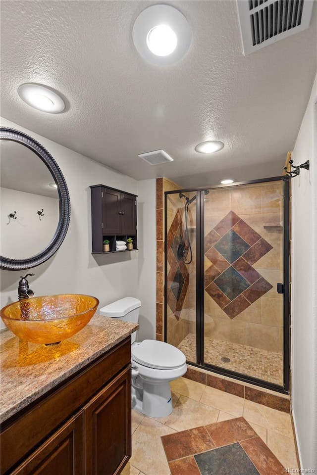 13404 E Jewell Ave Unit 101, Aurora, CO 80012 - bathroom with vanity, a textured ceiling, and a shower stall