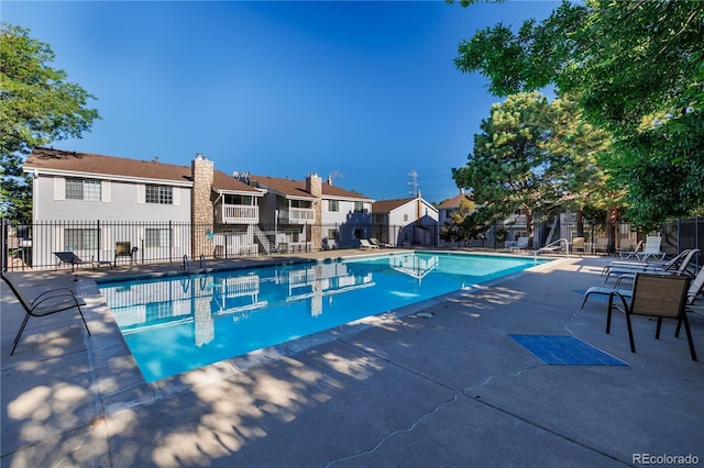13404 E Jewell Ave Unit 101, Aurora, CO 80012 - community pool featuring a patio area and a residential view