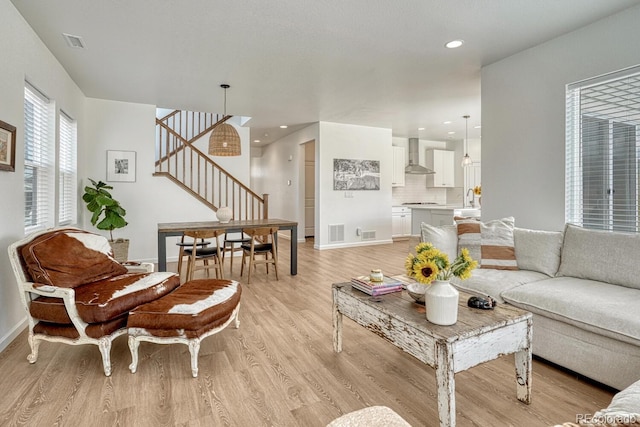 17396 Hop Clover Ave, Parker, CO 80134 - living room with stairway and light wood-style flooring