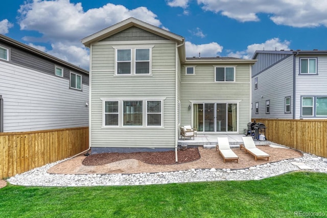17396 Hop Clover Ave, Parker, CO 80134 - back of house with a patio and a fenced backyard