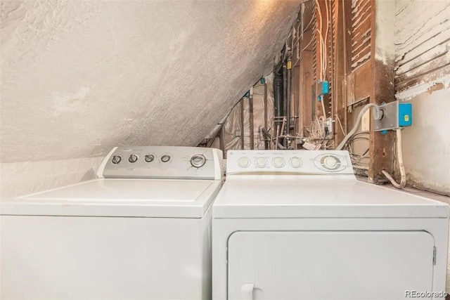 laundry room with washing machine and clothes dryer