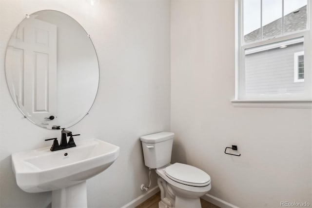 bathroom with toilet and sink