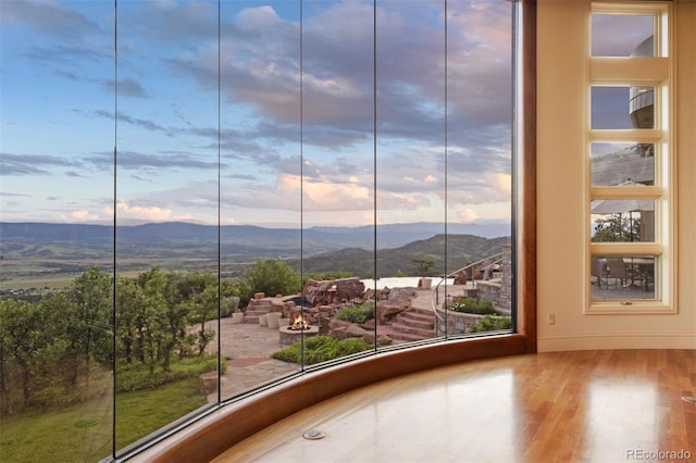 606 Cliffgate Ln, Castle Rock, CO 80108 - empty room featuring a mountain view and wood finished floors