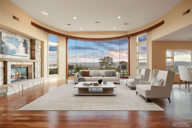 606 Cliffgate Ln, Castle Rock, CO 80108 - living room with wood finished floors, a fireplace, and recessed lighting