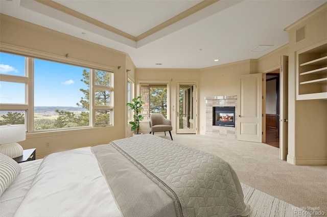 606 Cliffgate Ln, Castle Rock, CO 80108 - carpeted bedroom with multiple windows, ornamental molding, and a tiled fireplace