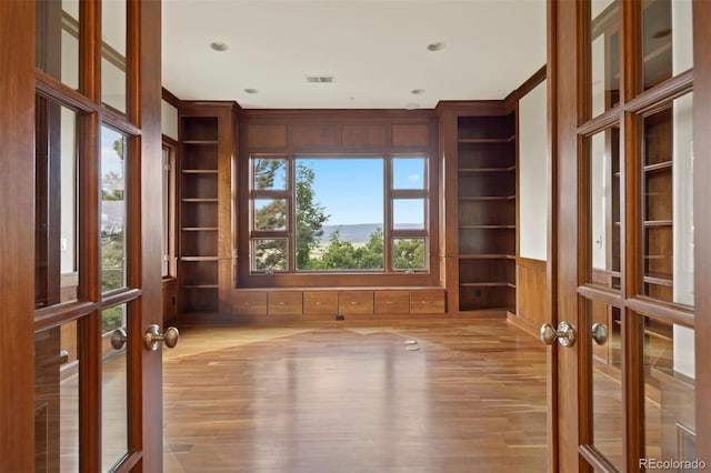 606 Cliffgate Ln, Castle Rock, CO 80108 - unfurnished room with french doors, built in features, and wood finished floors