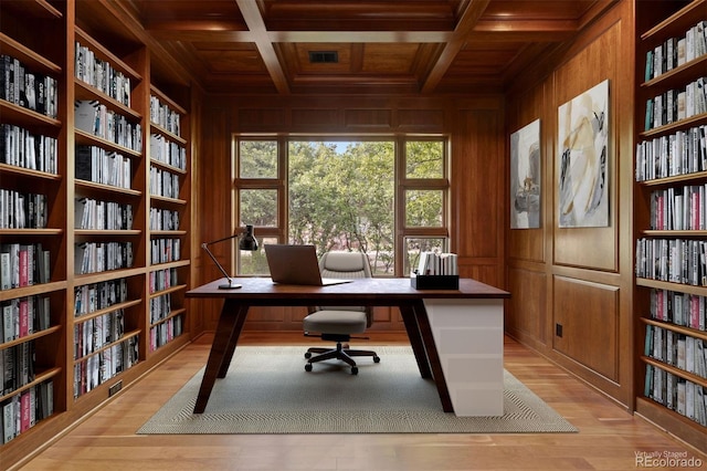 606 Cliffgate Ln, Castle Rock, CO 80108 - office with a wood ceiling with exposed beams, wood walls, light wood finished floors, coffered ceiling, and bookshelves