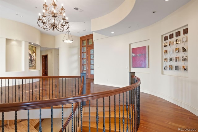 606 Cliffgate Ln, Castle Rock, CO 80108 - hall with an upstairs landing, wood finished floors, a chandelier, and recessed lighting