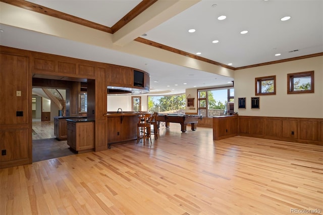 606 Cliffgate Ln, Castle Rock, CO 80108 - kitchen featuring light wood-type flooring, billiards, a peninsula, a wainscoted wall, and brown cabinetry