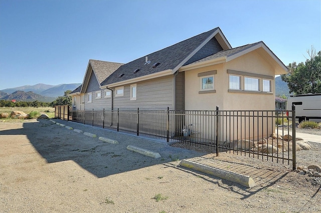 view of property exterior featuring a mountain view