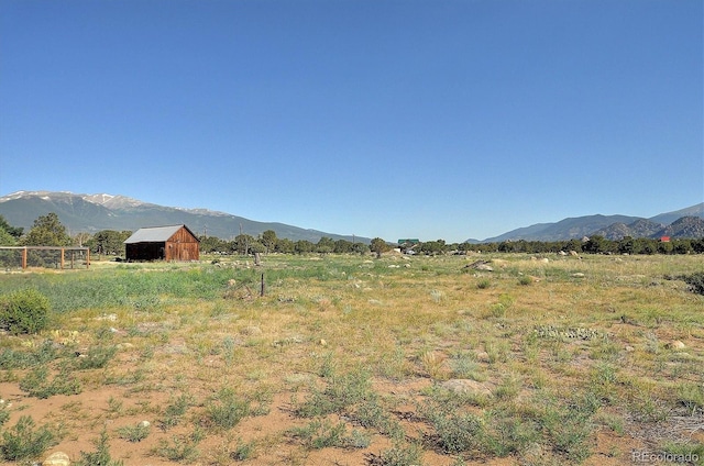 property view of mountains featuring a rural view