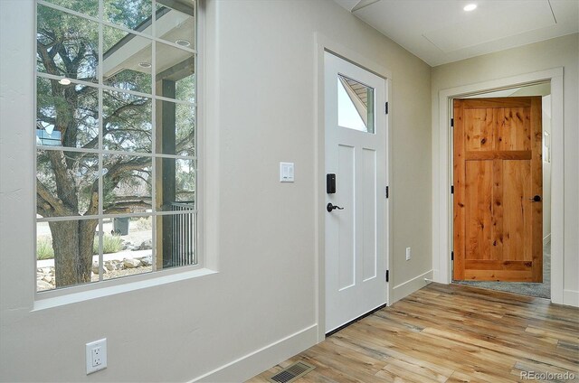 entryway with light hardwood / wood-style flooring