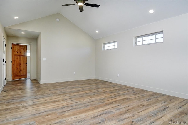 interior space featuring ceiling fan, light hardwood / wood-style floors, and high vaulted ceiling