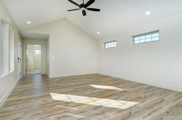 unfurnished room with light hardwood / wood-style floors, ceiling fan, and high vaulted ceiling