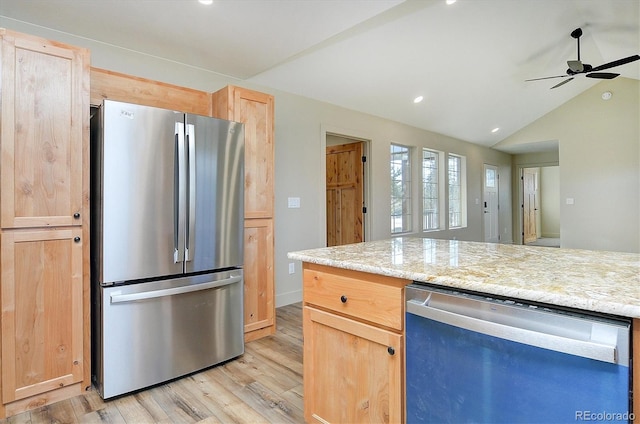 kitchen with light hardwood / wood-style floors, lofted ceiling, appliances with stainless steel finishes, ceiling fan, and light brown cabinetry