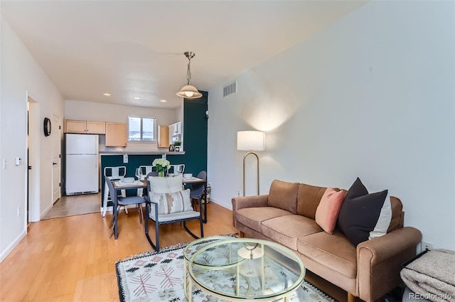 85 Uinta Way Unit 702, Denver, CO 80230 - living area with light wood-style floors, baseboards, and recessed lighting