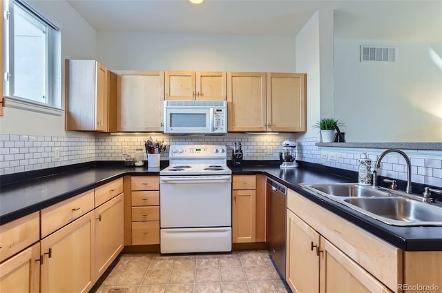 85 Uinta Way Unit 702, Denver, CO 80230 - kitchen with white appliances, a sink, light brown cabinetry, tasteful backsplash, and dark countertops