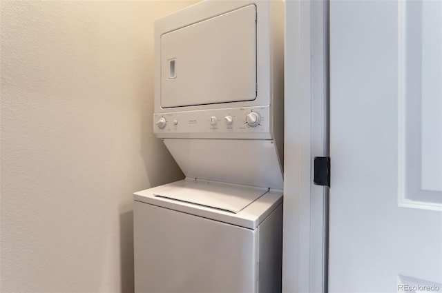 85 Uinta Way Unit 702, Denver, CO 80230 - laundry area featuring stacked washing machine and dryer